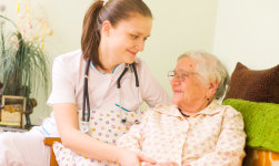 caregiver talking to an elder